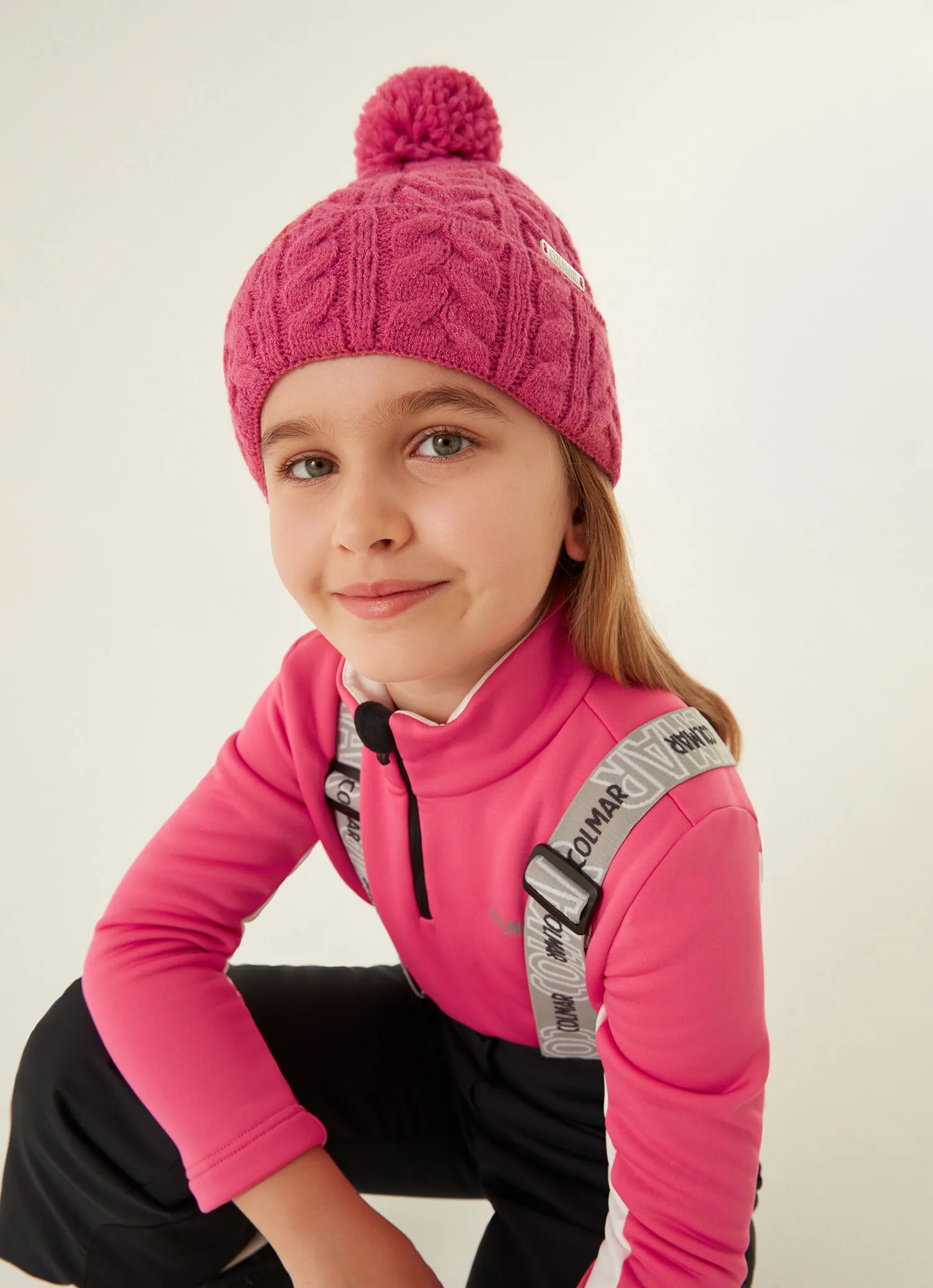 Braided girl's hat with pompom