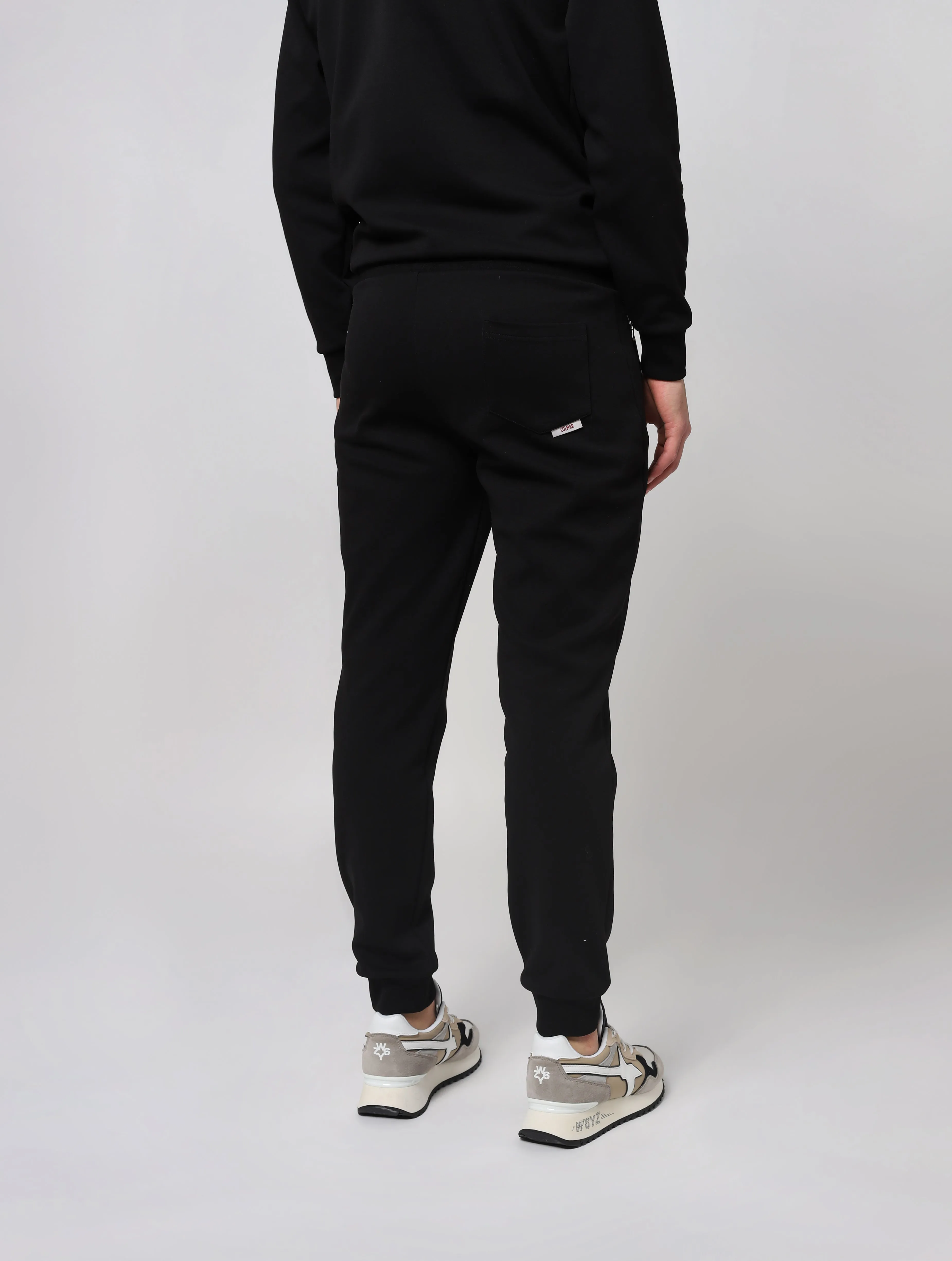 Pantaloni con vita elasticizzata in maglia a costine con coulisse di regolazione tasche laterali con zip taschino posteriore fon